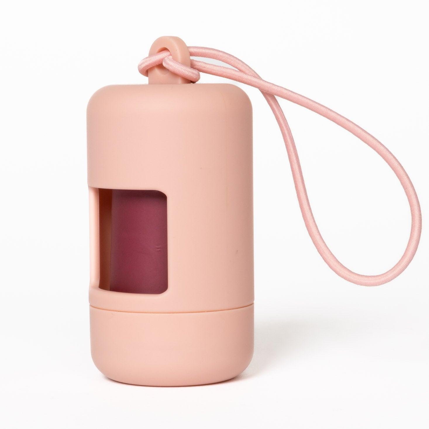 Pink lip balm case with a lanyard on a white background