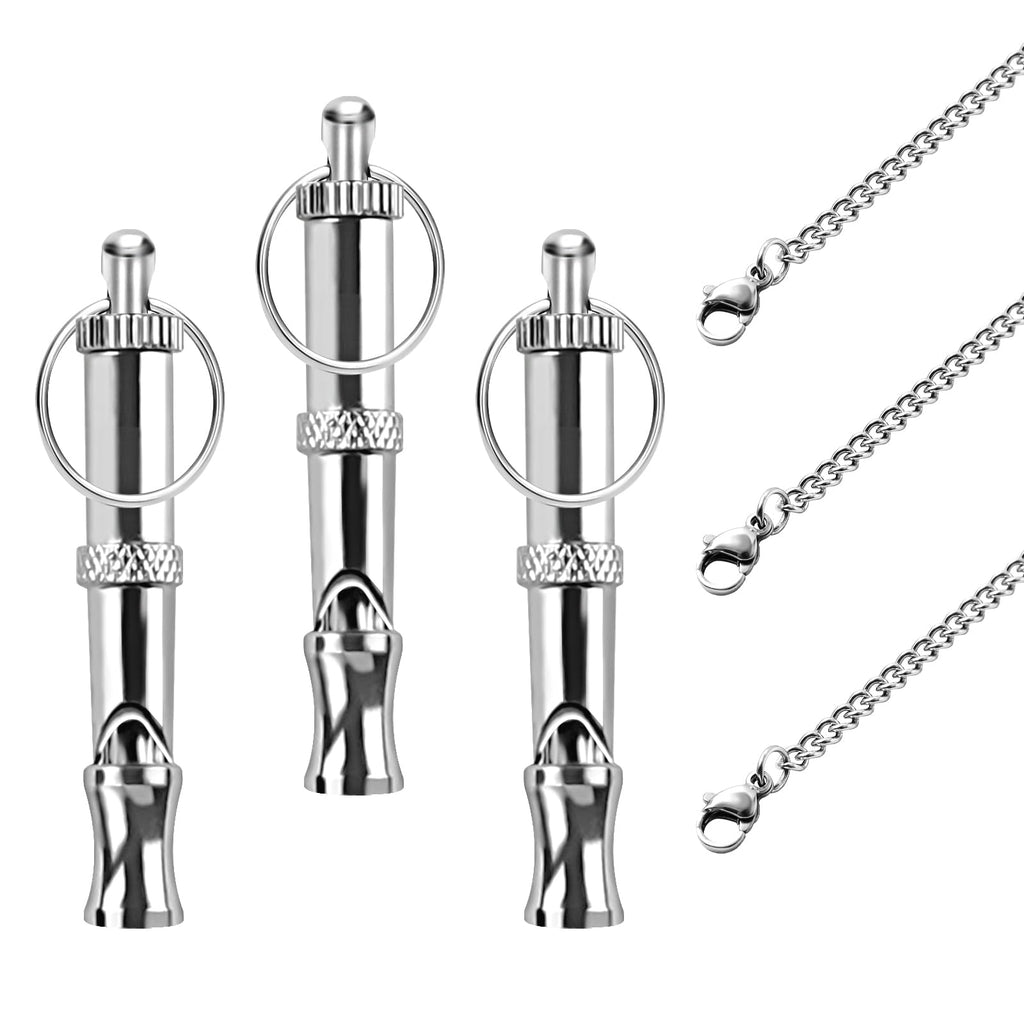 Set of silver dog whistles with chains on a white background