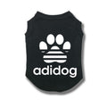 Black pet shirt with white paw print and 'adidog' text on a white background