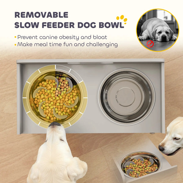 Removable slow feeder dog bowl with dogs eating from it on a wooden floor.