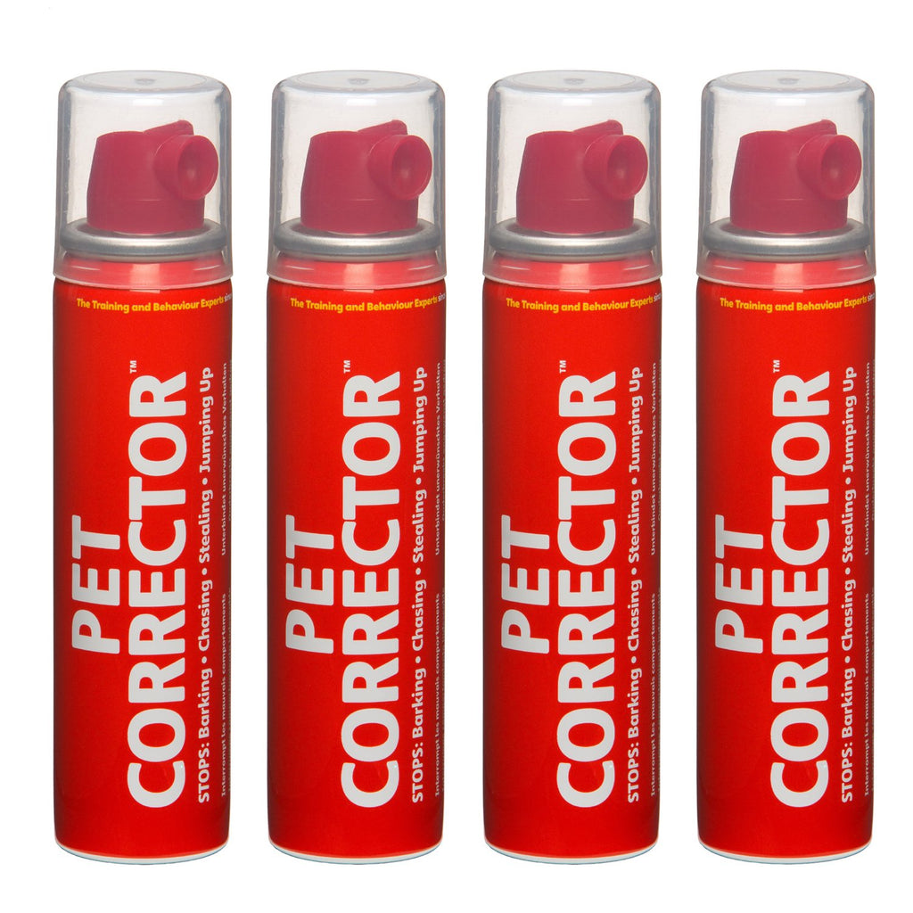 Four red cans of Pet Corrector on a white background
