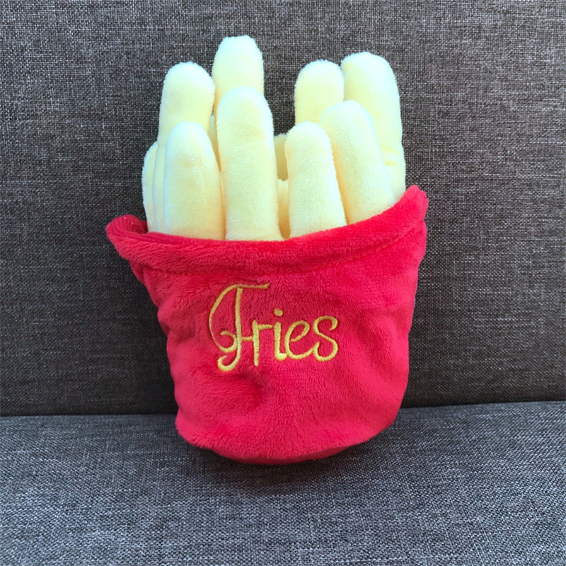 Red container with 'Fries' text filled with toy french fries on a gray background