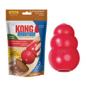 Red KONG dog toy next to its packaging on a white background