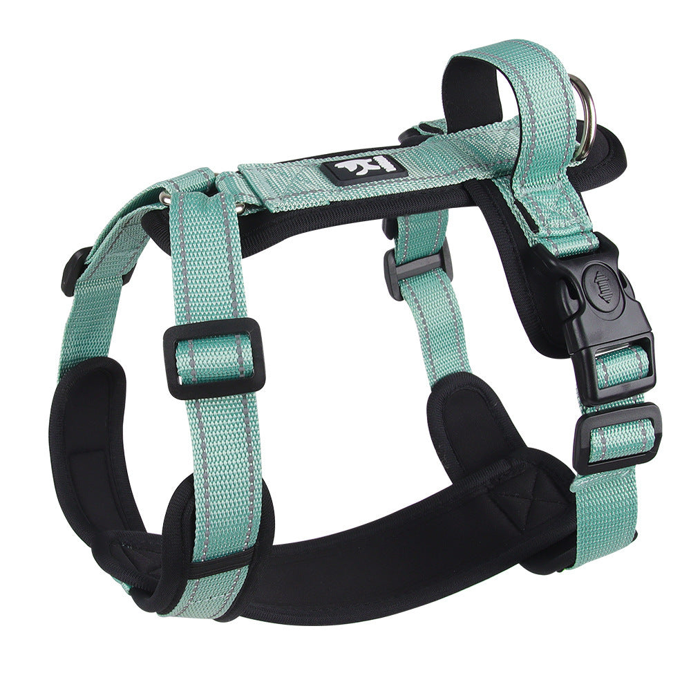 Teal dog harness with black padding on a white background