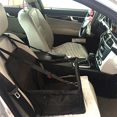 Pet seat cover in a car with a visible car seat and steering wheel.