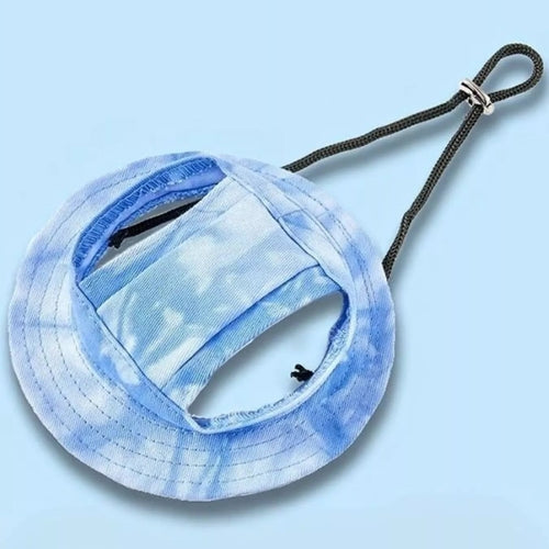 Blue tie-dye bucket hat with a black strap on a light blue background