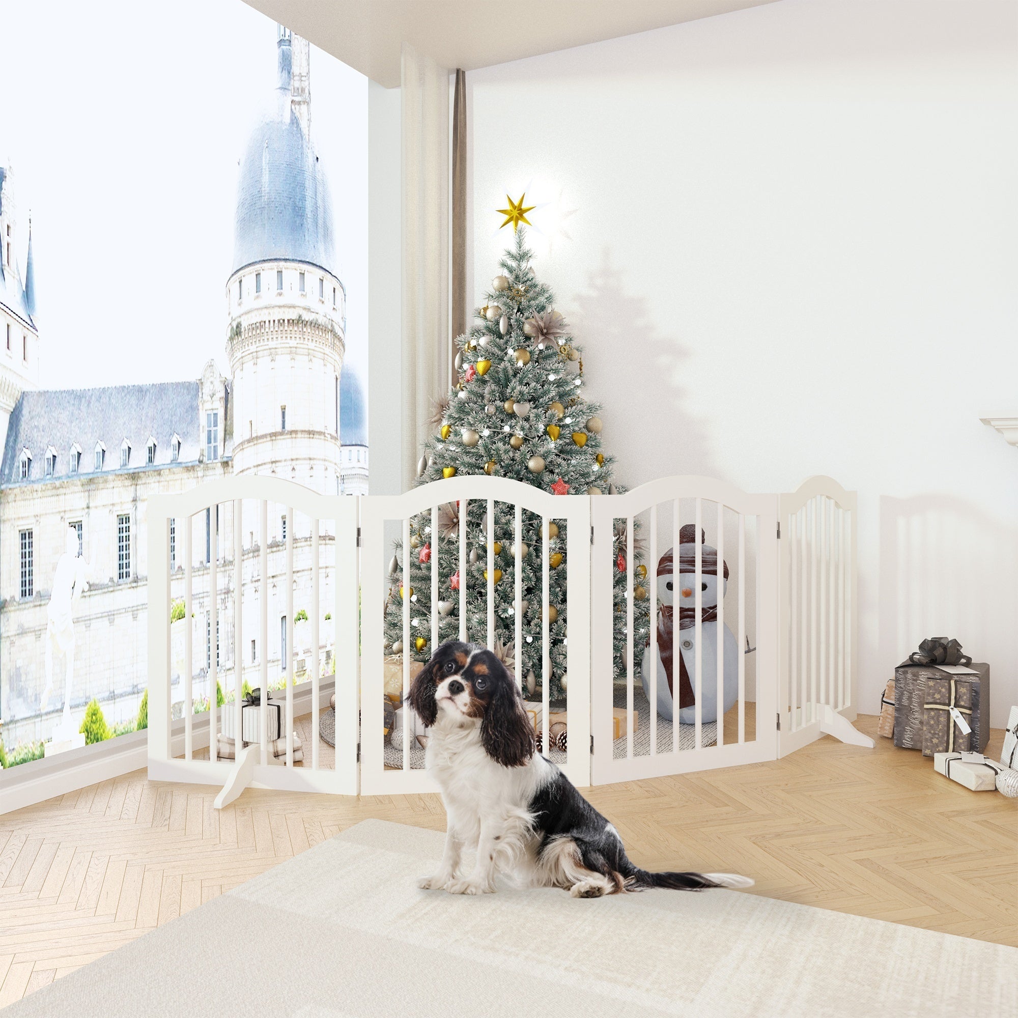 Two dogs sitting inside a white pet gate with a Christmas tree in the background.