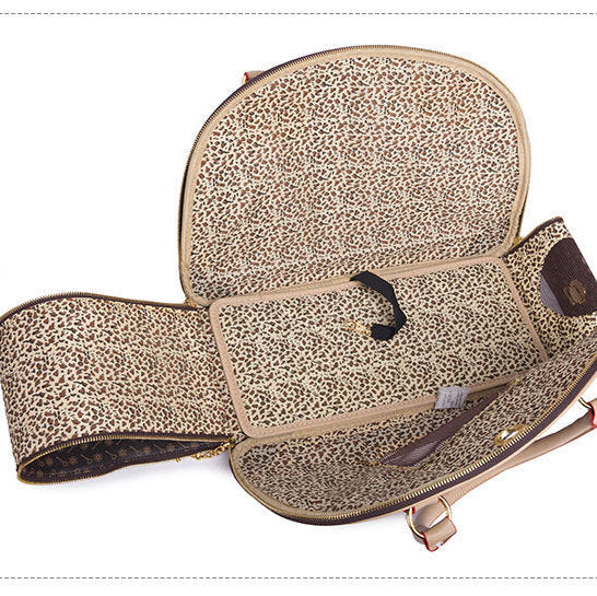 Leopard print baby carrier on a white background
