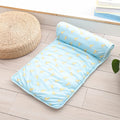 Light blue mat with yellow patterns on a wooden floor