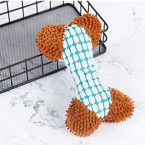 Dog toy with brown ends and a blue patterned middle on a marble surface.