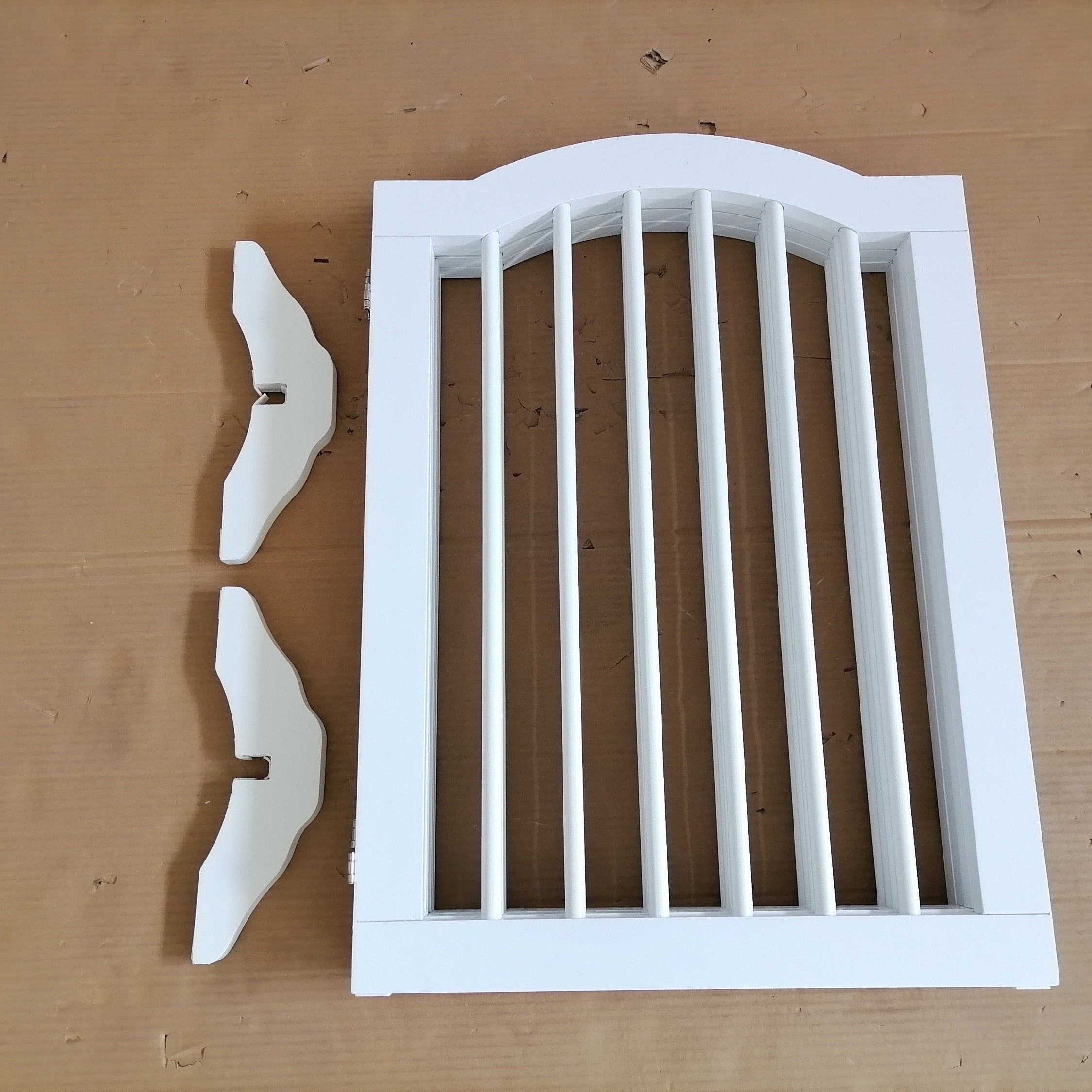 White wooden lattice panel on a brown wooden surface