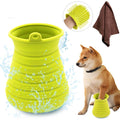 Collapsible green dog water bowl with a dog and towel on a white background