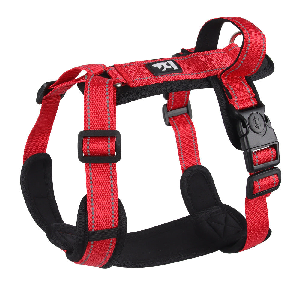 Red dog harness with black straps on a white background