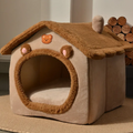 Pet house with teddy bear design on a neutral background