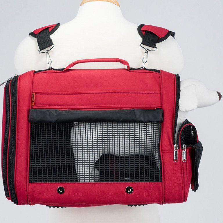Red pet carrier with a black interior on a mannequin against a white background