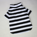 Black and white striped pet shirt on a light gray background