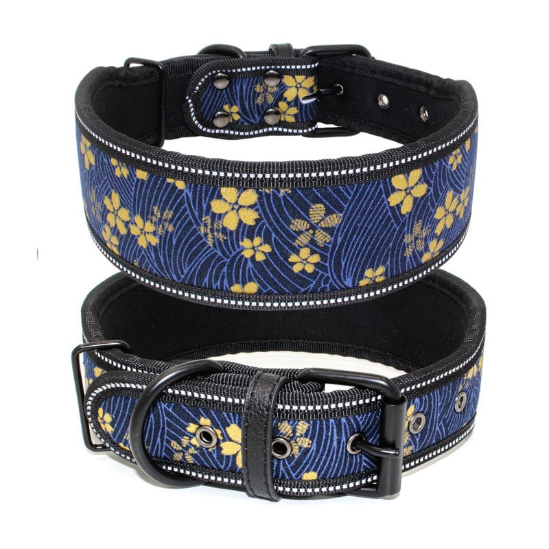 Blue floral-patterned dog collar with black strap on a white background
