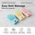 Three pet bath and massage brushes in blue, yellow, and pink on a marble surface.