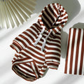 Brown and white striped dog outfit on a light background