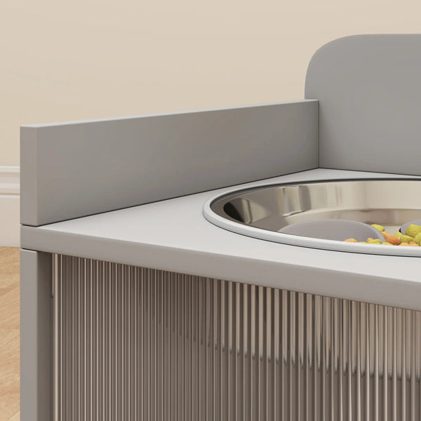 Gray pet feeding station with a bowl and food on a beige background