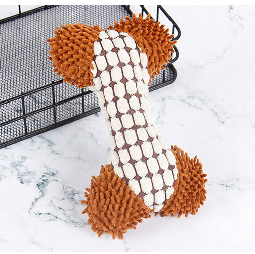 Dog toy shaped like a bone with brown ends on a marble surface