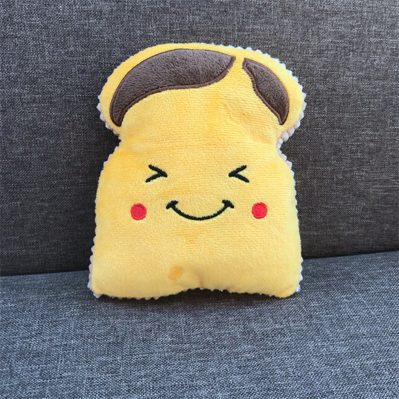 Plush toy shaped like a smiling piece of toast on a gray couch.