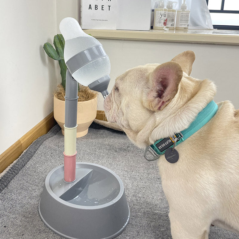 Dog interacting with a stand-mounted pet toy indoors.