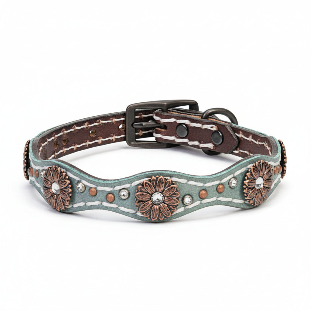 Decorative dog collar with floral patterns and metallic accents on a white background