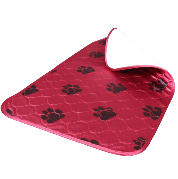 Red pet mat with black paw prints on a white background