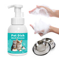 Pet dish wash mousse bottle with hands applying foam and metal bowls on a white background