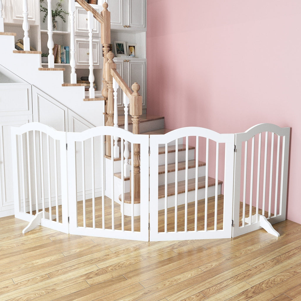 White pet gate in a home setting with a staircase and pink wall.