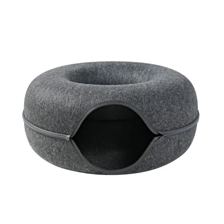 Gray pet bed with a round entrance on a white background