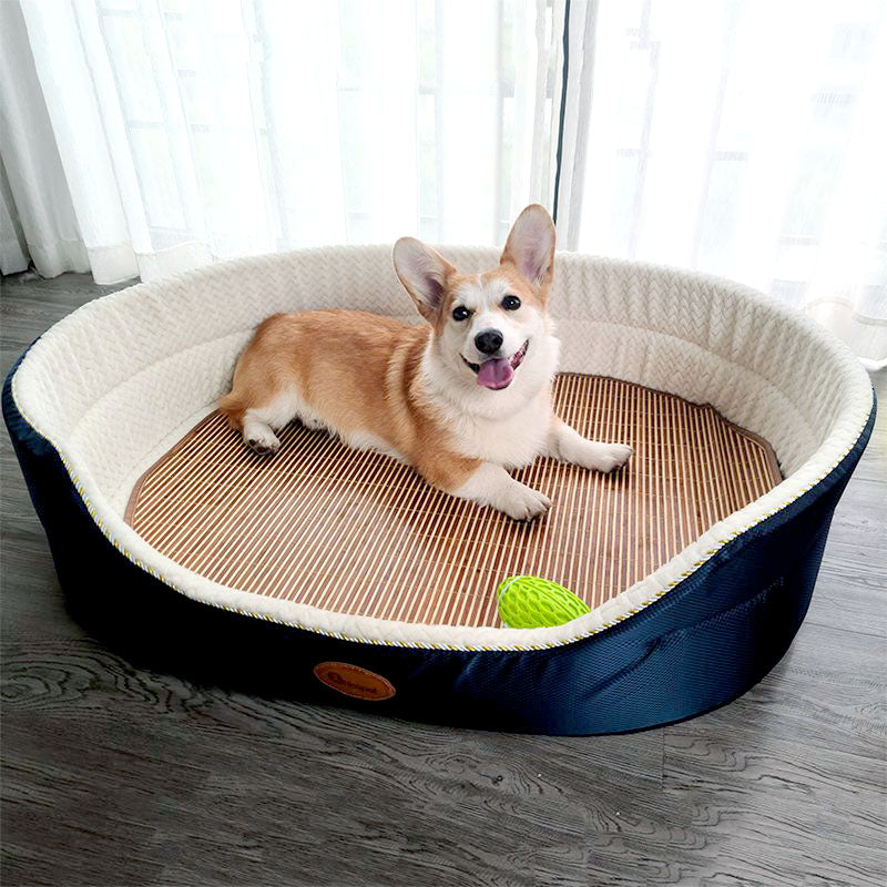 Dog lying on a round pet bed with a wooden surface and a green leaf toy.