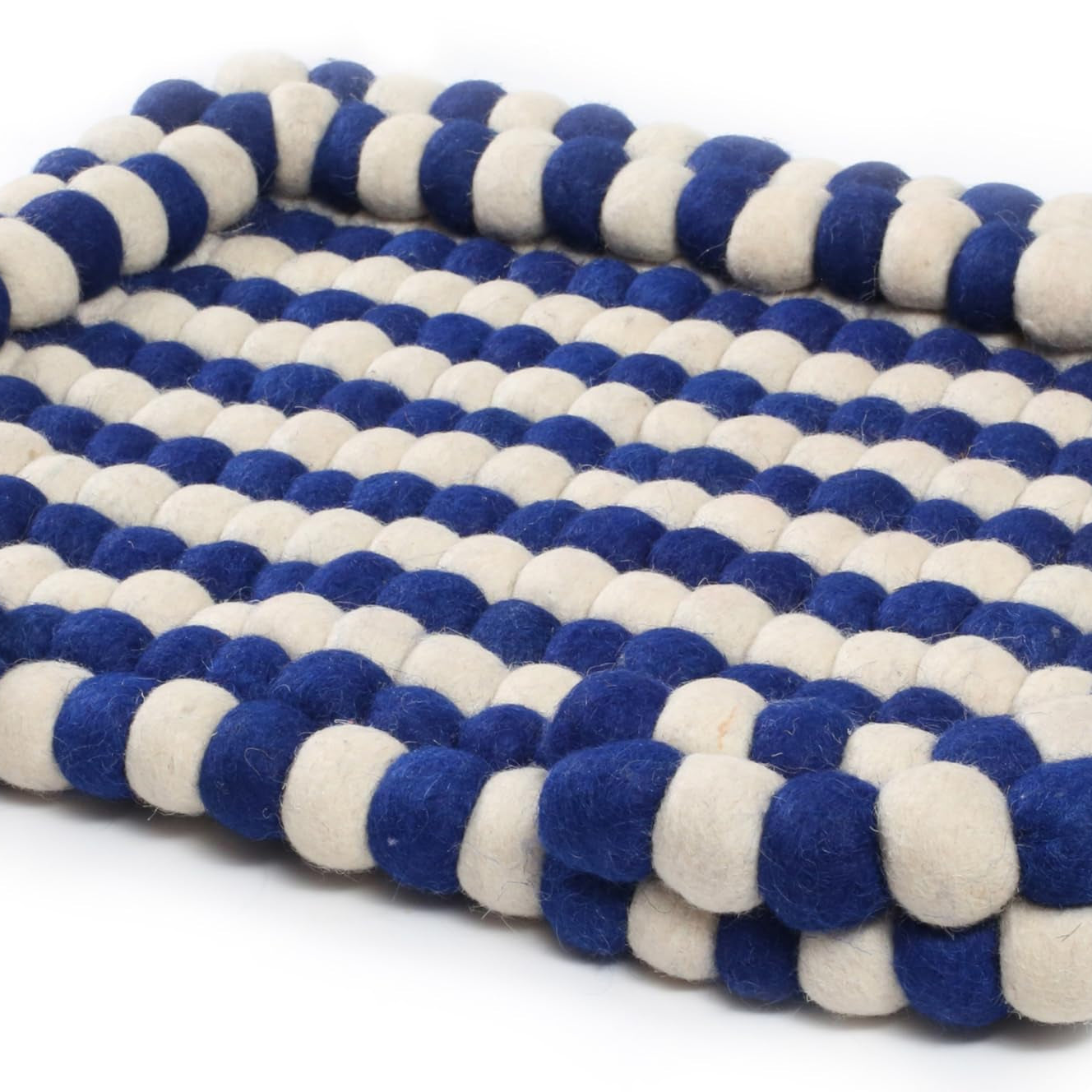 Blue and white striped pet bed on a white background