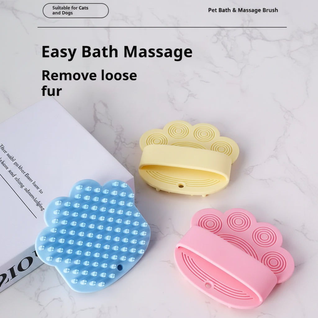 Three pet bath and massage brushes in blue, yellow, and pink on a marble surface.