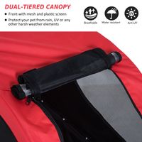 Red inflatable kayak with a dual-tiered canopy, mesh, plastic screen, and protective features.