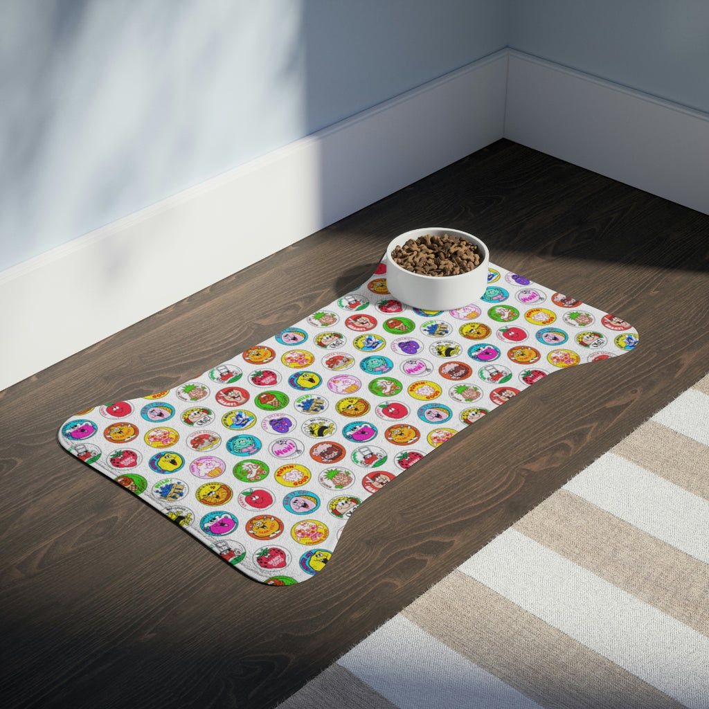 Colorful pet mat with a bowl of food on a wooden floor.