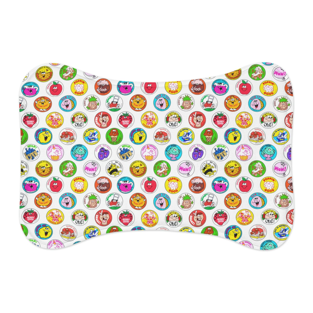 Rectangular mat with colorful cartoon character patterns on a white background