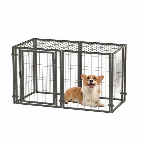 Dog inside a large metal dog crate on a white background