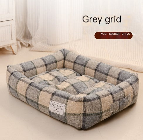 Plaid pattern pet bed with 'Pet Nest' label on a neutral background