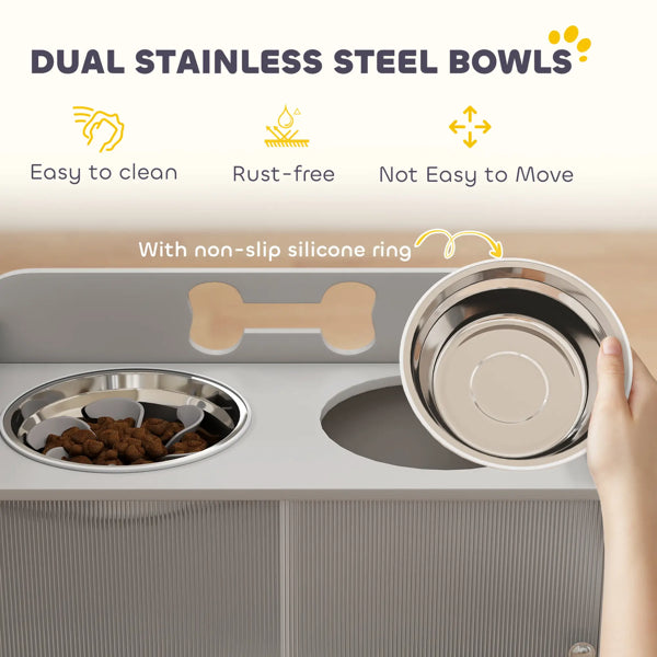 Dual stainless steel bowls with a hand holding one of them, on a light background.
