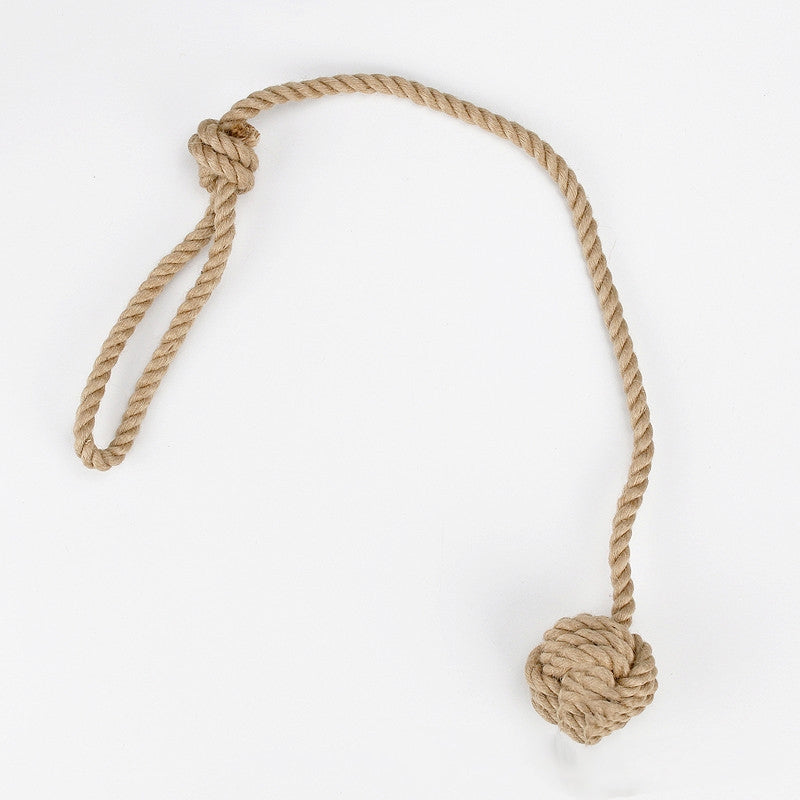 Nautical rope with a knotted ball on a white background
