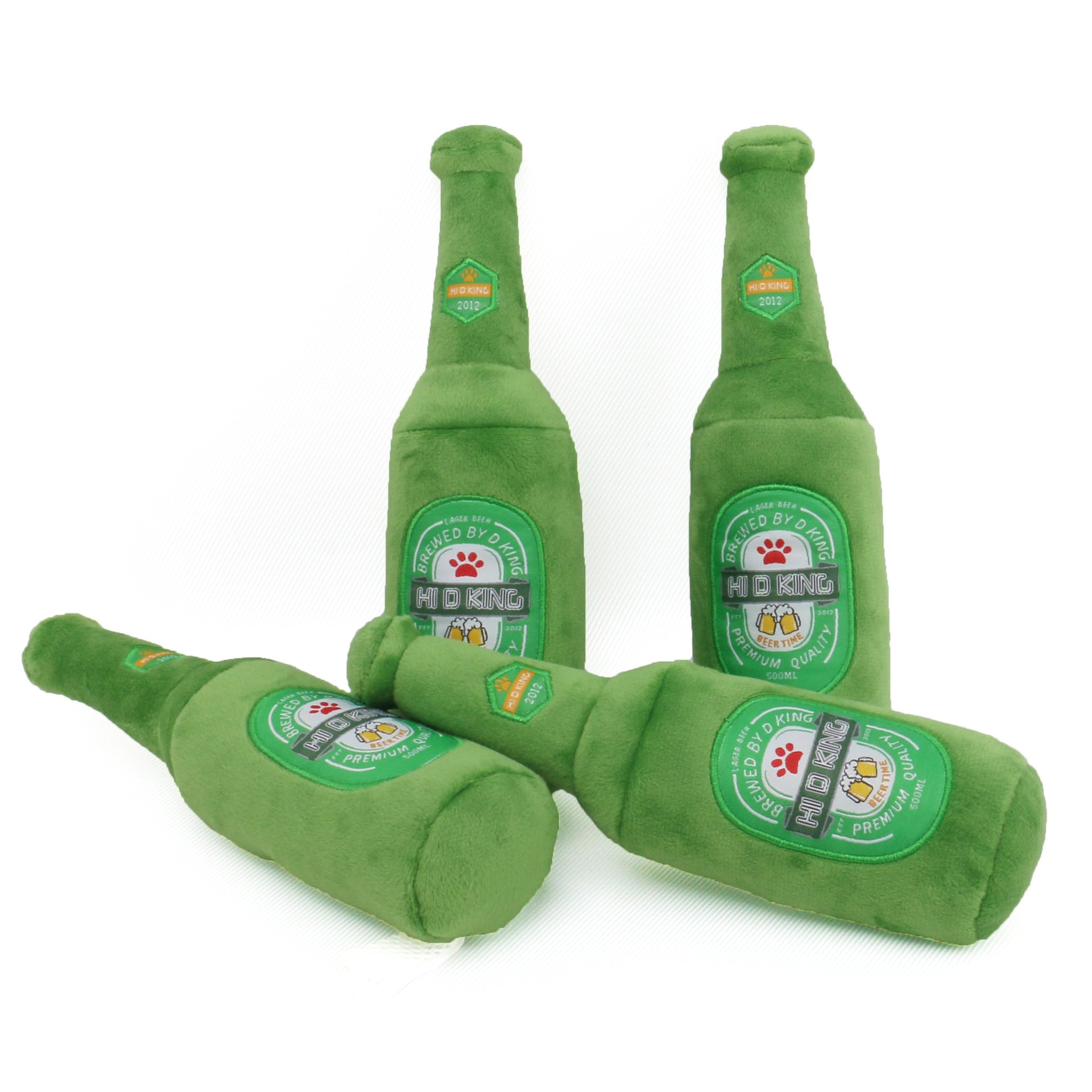 Green plush bottle toys with visible branding on a white background