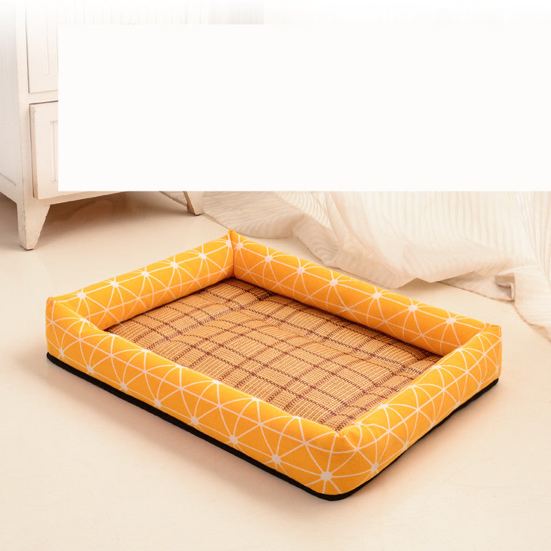 Dog bed with orange geometric pattern and woven surface on a light wooden floor.