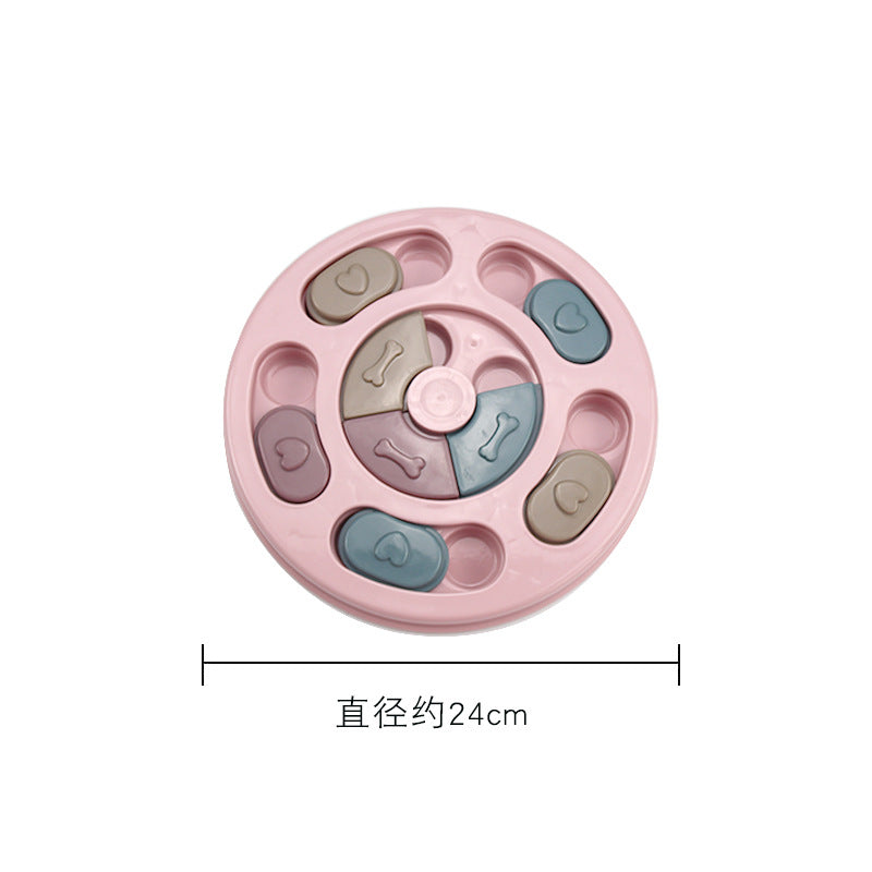 Pink dog toy with letter and symbol designs on a white background