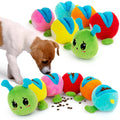 Colorful caterpillar-shaped dog toys with a puppy interacting with them on a white background.