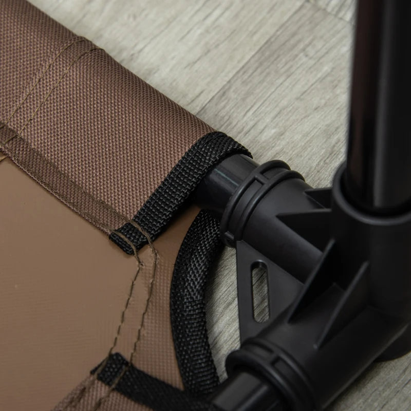 Close-up of a brown fabric with black plastic components on a textured surface
