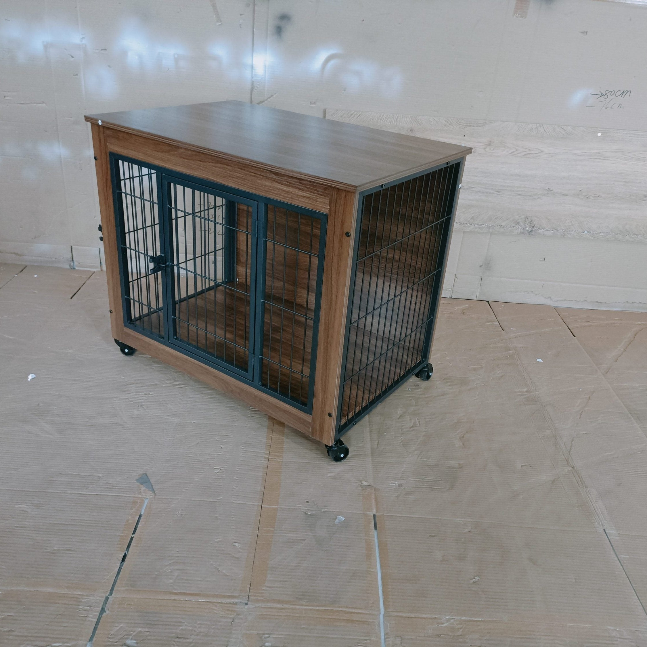 Dog crate with wooden frame and metal bars on a tiled floor.