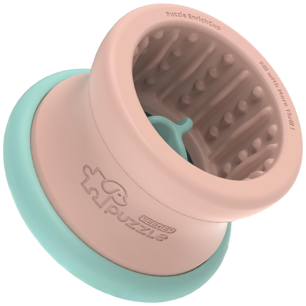 Pink and teal puzzle toy with textured interior on a white background