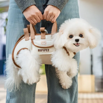 Small white dog in a beige and brown pet carrier with 'HIPIPET' branding.